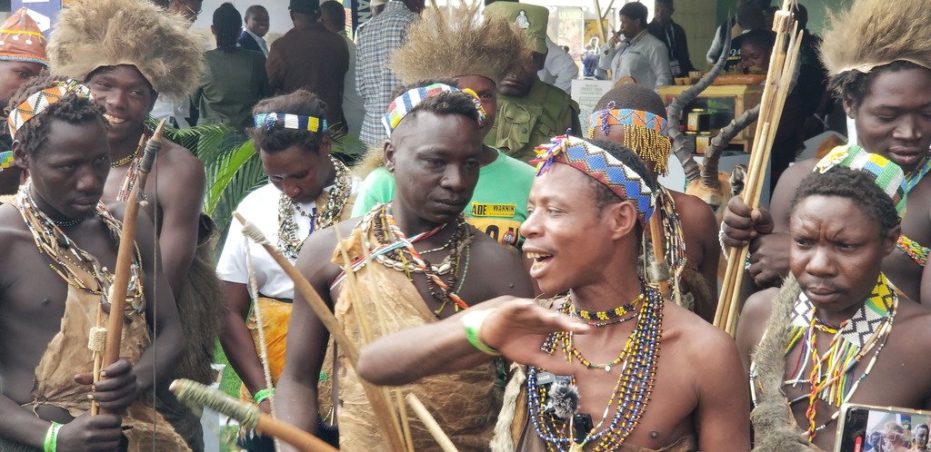 What Makes the Hadzabe Tribe So Unique? a group of Hadzabe people wearing colorful jewelry and traditional attire