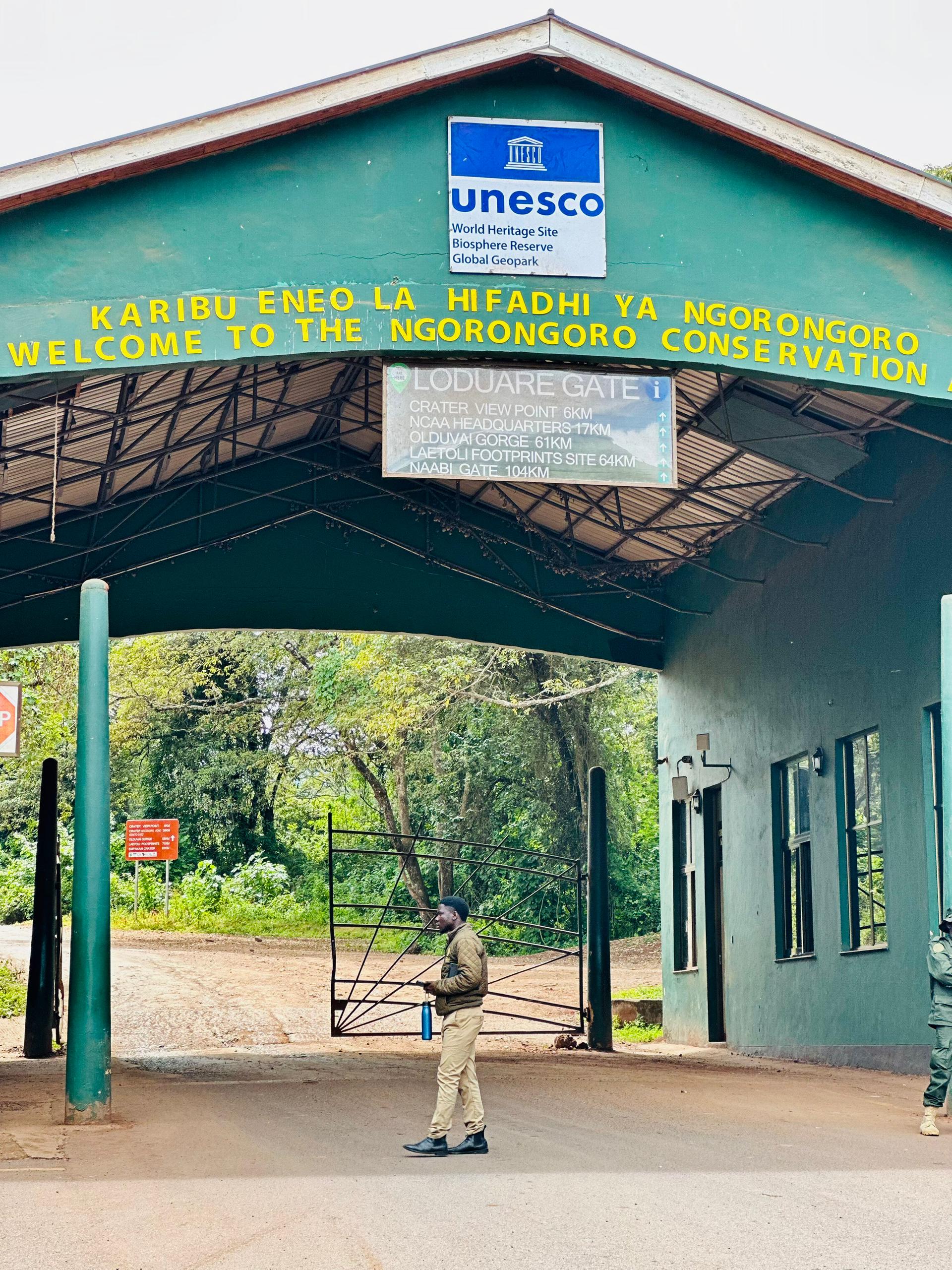 a man standing in front of Ngorongoro NP entrace