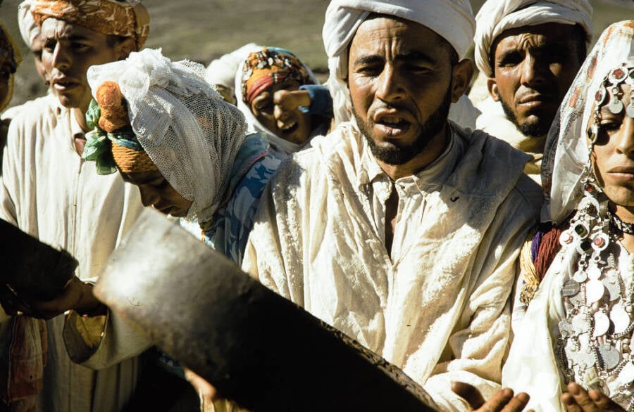 Berber men singing with traditional drums and attires in North Africa